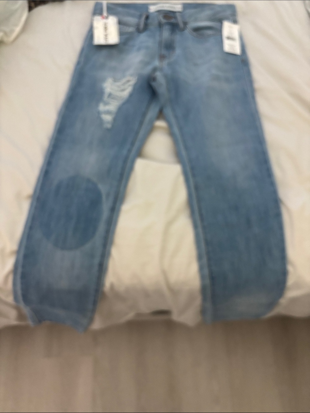Light Wash Distressed Jeans with Knee Patch